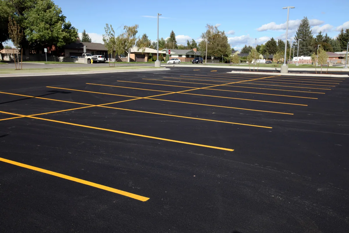 commercial parking lot with fresh yellow line striping from Cincinnati Asphalt