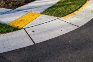 ada curb with textured pavement for seeing impaired