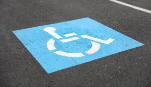 ada parking lot compliance services in cincinnati, wheelchair accessible logo painted on parking space