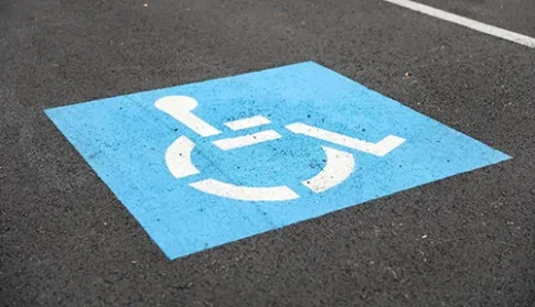 Accessible parking sign beside an ADA parking space