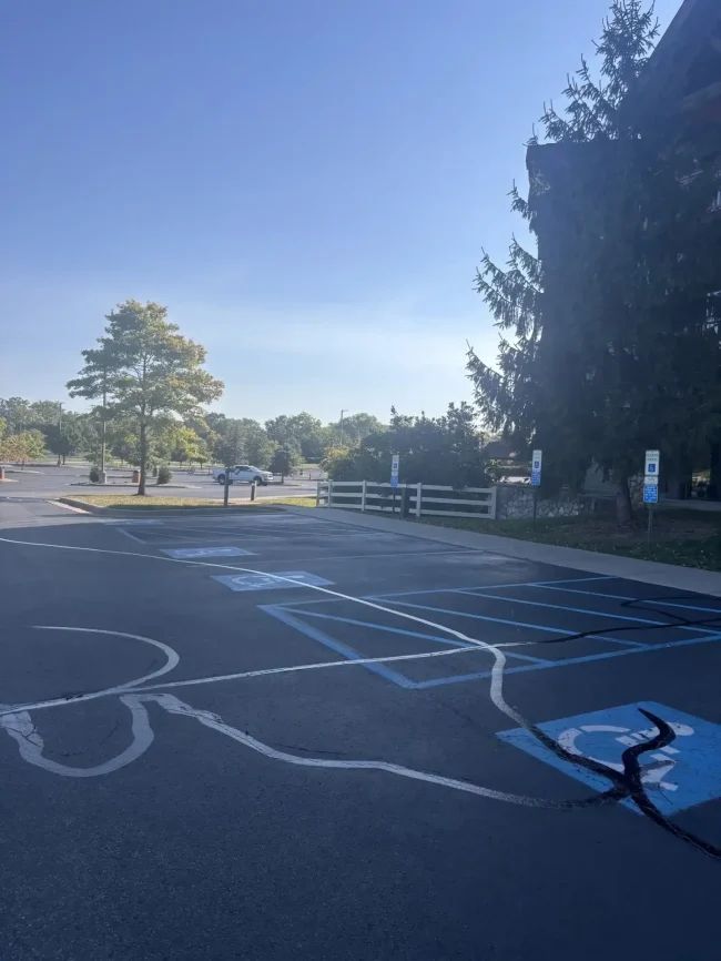 Completed asphalt crack filling project in a parking lot