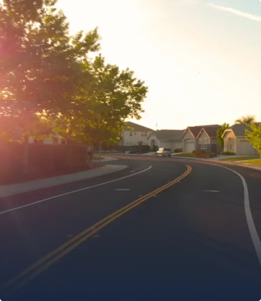Open road with fresh asphalt paving in subdivision